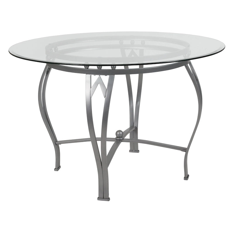Mesa de comedor redonda de cristal con estructura metálica curvada