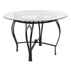 Mesa de comedor redonda de cristal con estructura metálica curvada